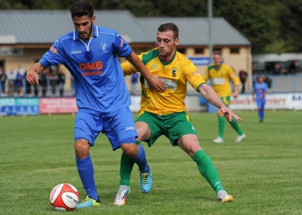 Josh Meade (left) in action for Matlock against Blyth on Saturday.