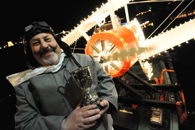 Matlock Bath Illuminations opening night. Pictured is Pete Hartshorn 1st place for his Biplane boat.
