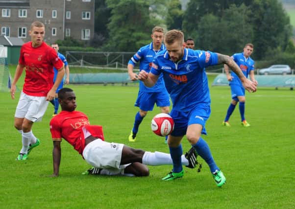 Corey Gregory (right) takes on the Ilkeston defence. Photo by Craig Lamont.