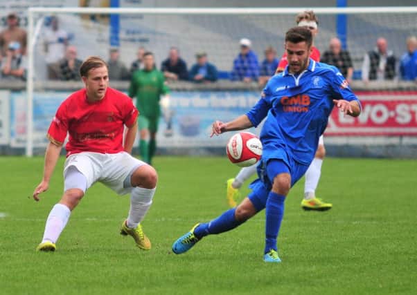 Josh Meade (right) in possession against Ilkeston. Photo by Craig Lamont.