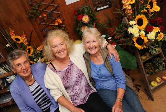 All Saints Church flower festival to raise money for new heating system in the church. Pictrued l-r is Joan Orme, Glenys Wilson and Joan Hatch all of whom have played a huge part in the organisation of the festival as well as much of the flower arranging.