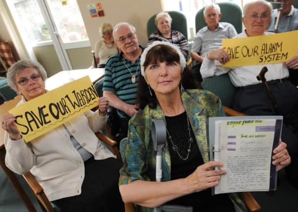 Residents at Glebe Court protest against planned council cuts to sheltered accommodation alarm systems and wardens. Fronted by Shirley Stewart.