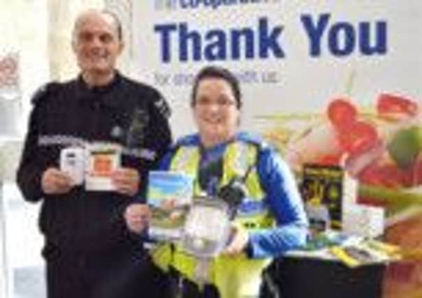 Sergeant Andy Wordsworth and PCSO Hayley Grundy visited the Co-operative store on Market Street, Bakewell to offer cut-price home security kits to passing shoppers.