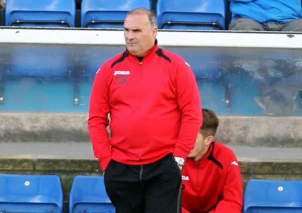 Mark Atkins watches on during the 4-0 defeat to Halesowen on Saturday, which was to be his last game in charge. Photo by Dan Westwell.