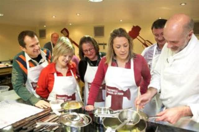 TV presenter Sarah Beeny joins a class at the Tideswell School of Food