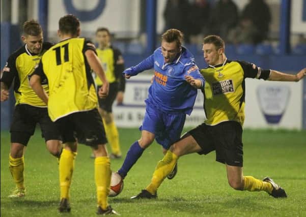 Matlock's Niall McManus finds no way through the Halesowen defence -Pic by: Richard Parkes