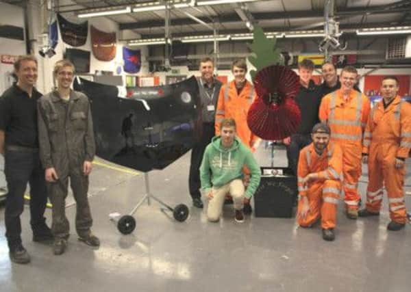 Pictured are Chesterfield College students Chris Batty,Ryan Stafford, Liam Garner, George Woodward, Dan Repton, Jack Nuttall alongside tutors Peter Jepson, Chris Wright and Greg Proffitt with their Armistice sculpture.