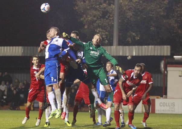 Alfreton pile on the pressure as Rovers 'keeper Steve Mildenhall punches clear -Pic by: Richard Parkes