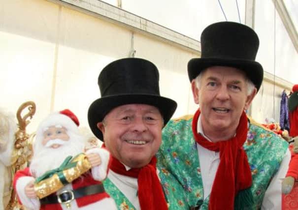 Christmas Cheer: Dave Melling and John Cragie of Newcastle pictured on their Singing Santa stall at the Matlock Victorian Market.