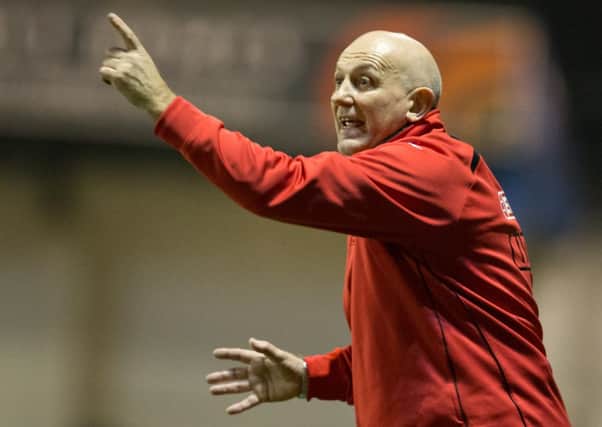 Matlock boss Dave Rushbury guides matters from the touchline against Rushall on Tuesday. Photo by James Williamson.
