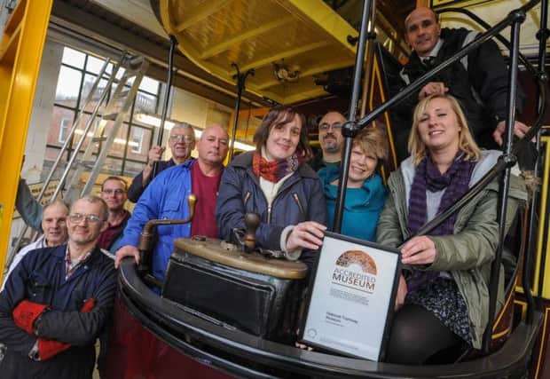 Crich Tramway Museum has been awarded accreditation by the Arts Council. Pictured are the team in the workshop with their certificate.