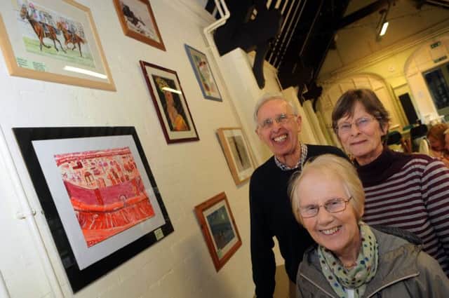 Margaret Lake and Ann Johnson from the Peak Artists Group and Sam Bettany from the Whittworth Centre take a look at the group's exhibition at the tea rooms in Darley Dale, where it will be on display for the next six weeks.