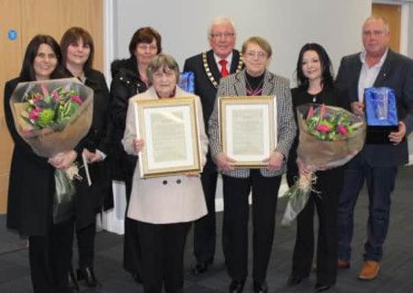 Bolsover District Council Chairman, Councillor Ken Walker, with families who received Honorary Alderman titles on behalf of former councillors Terry Cook and Tom Rodda who passed away in 2014.