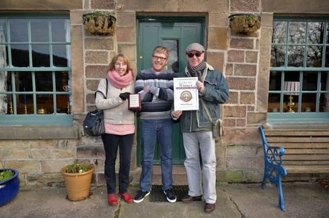 The White Lion, Starkholmes has won the Matlock Mercury Best Bar 2014. Owner Spence Slater, centre celebrates with regulars Jean and Dave Hunter