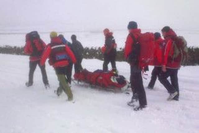 Mountain rescue teams came to the man's aid.