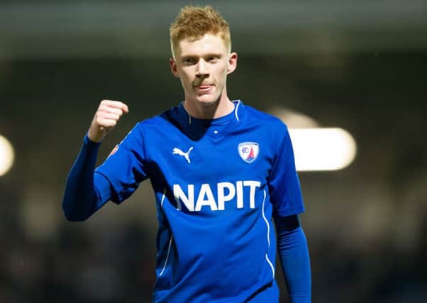 Sam Clucas punches the air at full time after their FA Cup win against Scunthorpe.