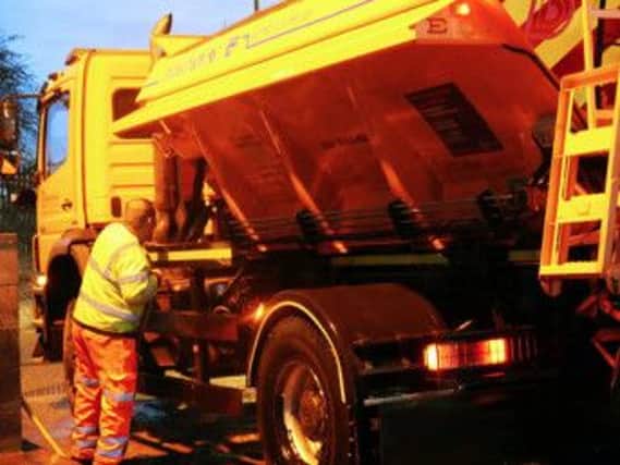 Derbyshire County Council gritter driver Neil Johnson washes down his vehicle after finishing his gritting route.