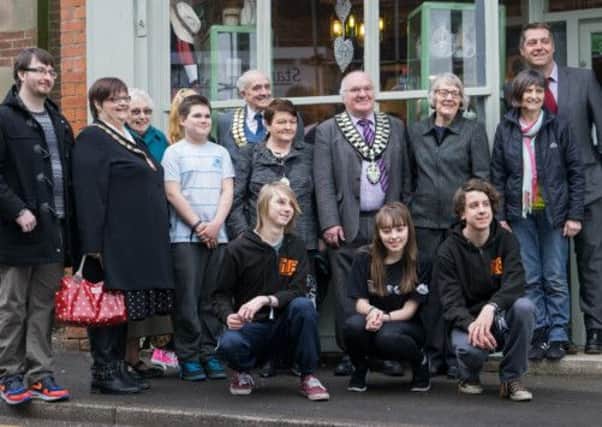 Authorities and supporters celebrate the success of the the MADE@No.18 community driven cafe project at number 18, Church Street Alfreton.