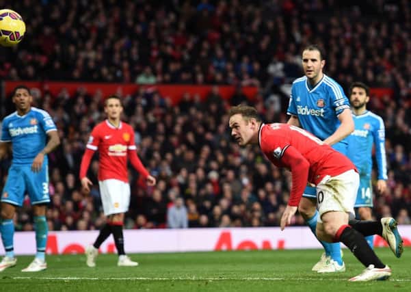 GOLDEN GOAL -- Wayne Rooney scores the 84th minute goal for Manchester United against Sunderland that clinched Stuart McClung's £250,000 windfall. (PHOTO BY: Martin Rickett/PA Wire).