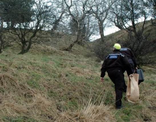 Police out collecting forensic evidence after badger setts were interfered with in an area near the Wash, Chapel-en-le-Frith.
