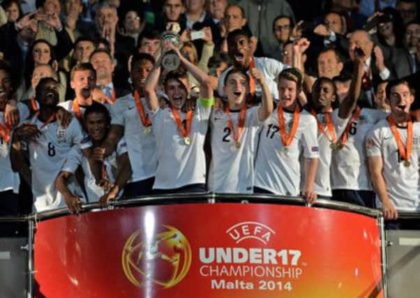 ATTARD, MALTA - MAY 21:  Players of England celebrate with the trophy after winning their UEFA Under17 European Championship 2014 final match between against Netherlands at Ta' Qali National Stadium on May 21, 2014 in Attard, Malta.  (Photo by Sascha Steinbach/Bongarts/Getty Images)