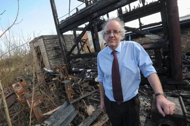 Alan Calladine at Midland Railway Centre with signal house that was set on fire during a vandalism attack.