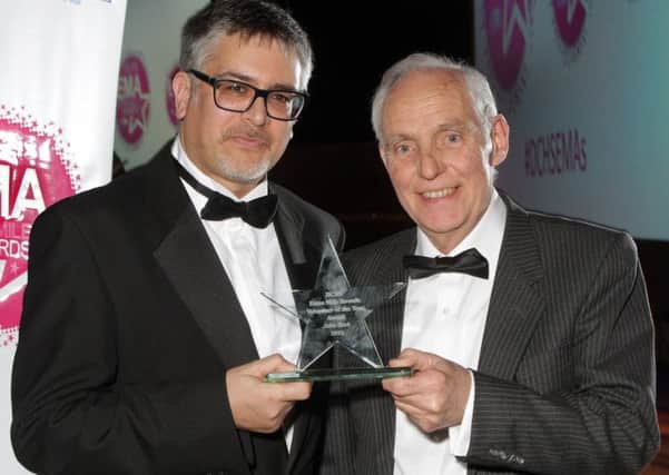 John Hart, right,  receives his Volunteer of the Year award from Tony Okotie, vice chairman of Derbyshire Community Health Services NHS Foundation Trust.