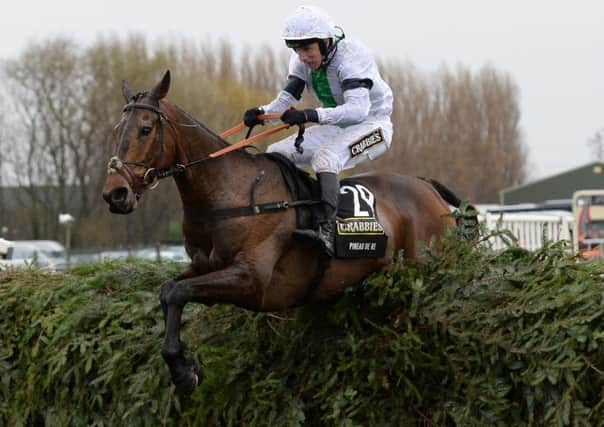DEFENDING CHAMPION -- Pineau De Re on his way to victory in last year's Crabbie's Grand National. He is back to defend his title. (PHOTO BY: John Giles/PA Wire).