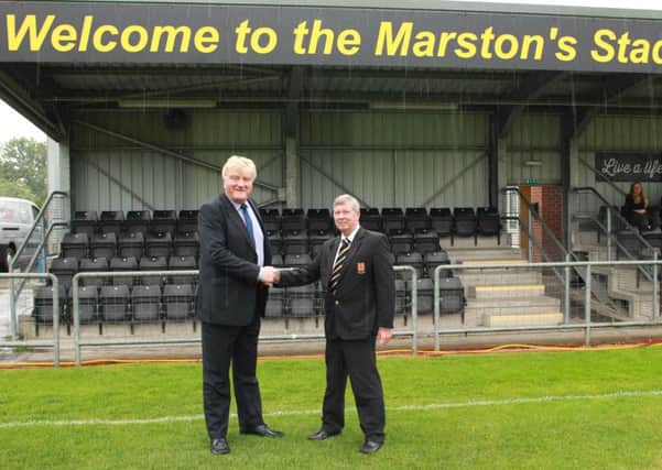 Belper Town FC Chairman Alan Benfield (right) shaking hands on the deal with Bob Leatherland, Marston's Business Development Manager, prior to the Nailers' pre-season friendly against a Derby County XI last Friday.

Photo by Tim Harrison