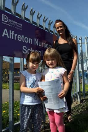 Head teacher Angela Stanton and children Chloe-May and Autumn with the oustanding ofsted award.