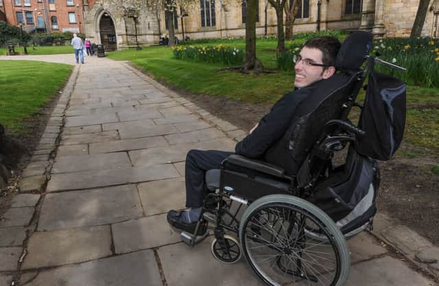 Nathan Roe - work experience student at The Derbyshire Times explains disabled access in Chesterfield Town Centre. Pictured here on the difficult pathway at St Marys Church.