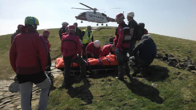 The new search and rescue helicopter lands at Mam Tor.