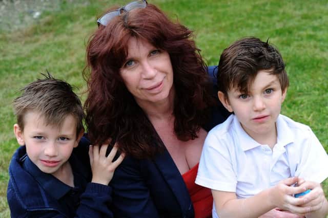 Denby mum, Andrea Thomas with her children, Jayme, left, and Elian Gonzalez-Thomas who needs an assistance dog.