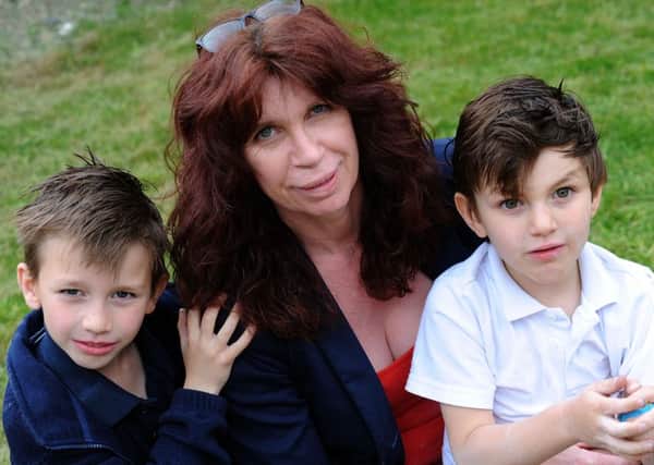 Denby mum, Andrea Thomas with her children, Jayme, left, and Elian Gonzalez-Thomas who needs an assistance dog.