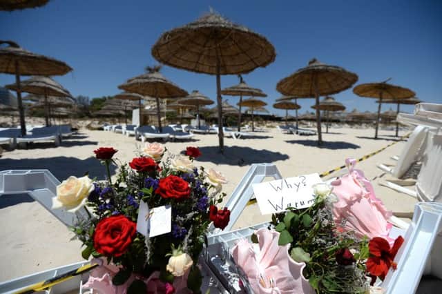 Flowers and a note which reads "Why? Warum?" on a sun lounger at the Imperial Marhaba Hotel in Sousse, Tunisia, 27 June 2015. At least 39 people were killed in the terror attack in the Tunisian beach resort Sousse - most of them tourists. Photo: ANDREAS GEBERT/DPA ... Attack on tourist hotel in Tunisia ... 27-06-2015 ... Sousse ... Tunisia ... Photo credit should read: Andreas Gebert/Unique Reference No. 23408235 ...