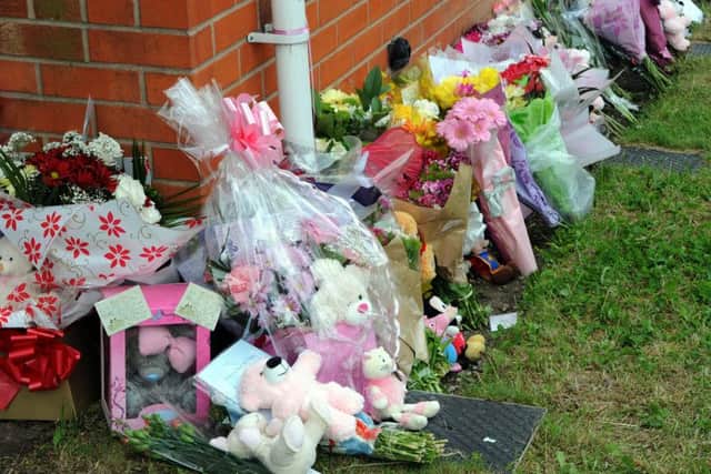 Flowers and gifts were left in tribute at the scene of the fire, North St, Langley Mill.