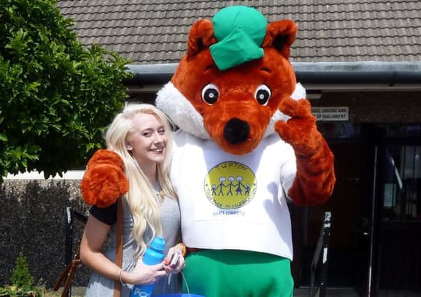 Foxy, mascot for Tupton Carnival, with Lucy Smith