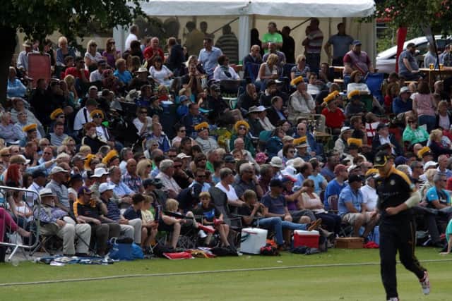 A packed crowd enjoyed the cricket.