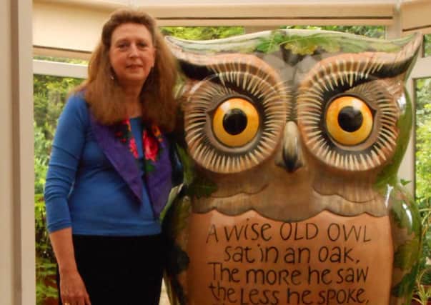 Elizabeth Forrest with her owl sculpture which is on display in Birmingham