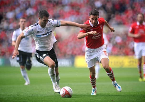 Nottingham Forest's Matt Derbyshire (right) and Derby County's Jason Shackell in action during the npower Football League Championship match at the City Ground, Nottingham. PRESS ASSOCIATION Photo. Picture date: Saturday September 17, 2011. Photo credit should read: Andrew Matthews/PA Wire. RESTRICTIONS: EDITORIAL USE ONLY. No use with unauthorised audio, video, data, fixture lists, club/league logos or "live" services. Online in-match use limited to 45 images, no video emulation. No use in betting, games or single club/league/player publications