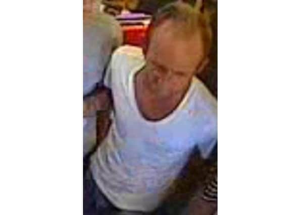 This man is wanted in connection with an assault on a train.