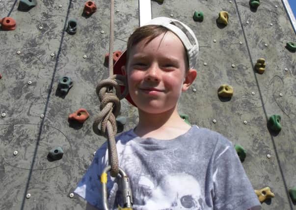 Jack Hayes has a go on the climbing wall at Titchfield Park