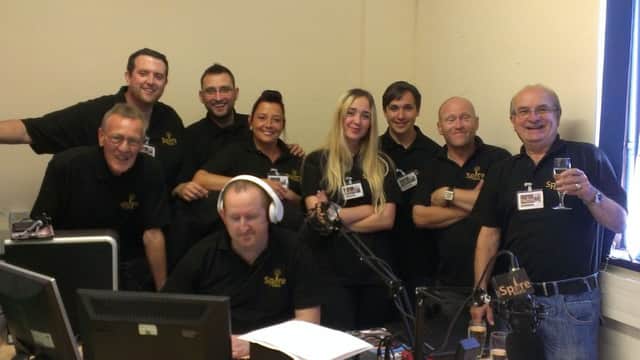 Geoff Cox, managing director (far right) with Paul Wragsdale (studio director) at the controls and members of the Spire Radio team.