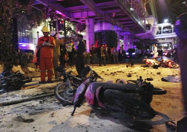Motorcycles are strewn about after an explosion in Bangkok, Monday, Aug. 17, 2015. A large explosion rocked a central Bangkok intersection during the evening rush hour, killing a number of people and injuring others, police said. (AP Photo/Jerry Harmer)