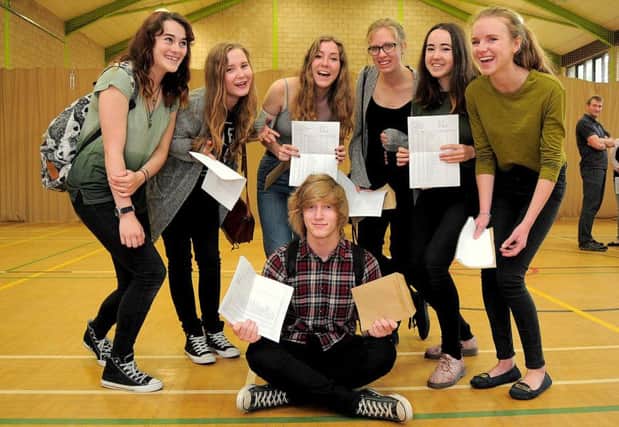 Students receiving their GCSE results in the Sports hall, at Highfields School, Matlock
Tom Coates (front), back L/R, Hollie Wells, Kate Round, Rebecca & Hannah Greatorex, Bronia Kidd, Lois Helman