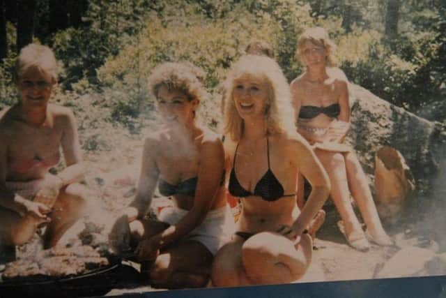 Sharon relaxing on the beach with other air hostesses.
