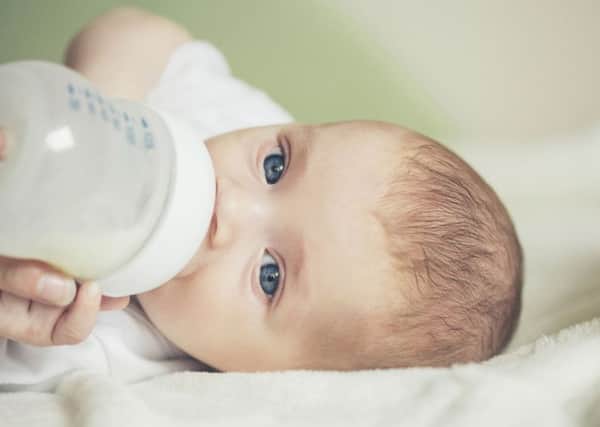 A Generic Photo of a baby drinking milk from a bottle. See PA Feature FAMILY Breastfeeding. Picture credit should read: PA Photo/thinkstockphotos. WARNING: This picture must only be used to accompany PA Feature FAMILY Breastfeeding.