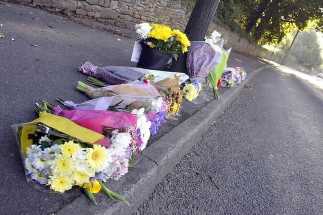 Tributes have been left at the side of the road.