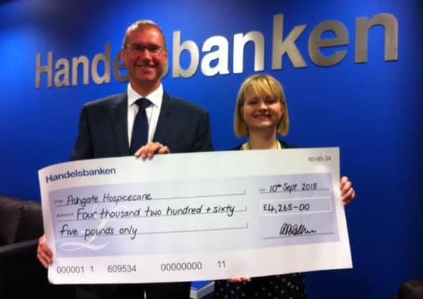 Chesterfield Handelsbanken's Phil Walker presents a cheque for £4,245 to Ashgate Hospicecare's fundraising director Esther Preston.