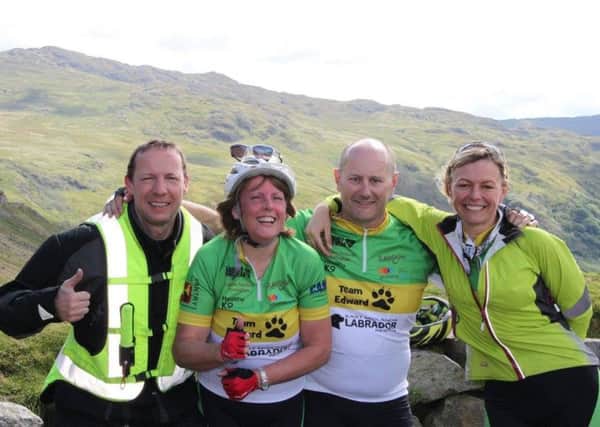 Team Edward's outback rider Colin Hodgkins and adveturers Amanda Reid, David Steeples and Wendy Hopewell took on the Ultimate Challenge's three peaks to help stray and ill-treated Labradors.